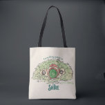 Everything Grows in THE SHIRE™ Tote Bag<br><div class="desc">Bring a little piece of Middle-Earth™ to your everyday with this charming Lord of the Rings™ design inspired by the cozy hills of Hobbiton. Featuring a storybook-style hobbit hole with its iconic round green door tucked into a lush hillside, the artwork is paired with the beloved phrase, “Everything grows in...</div>