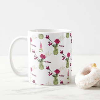 Exotic flower arrangement in glass coffee mug