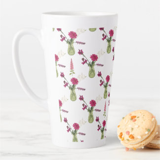 Exotic flower arrangement in glass latte mug
