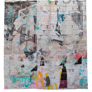 Exposed weathered brick wall with torn street post
