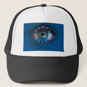 Eye looks through Europe flag background concept Trucker Hat