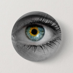 Eye looks to viewer concept macro 2 inch round button