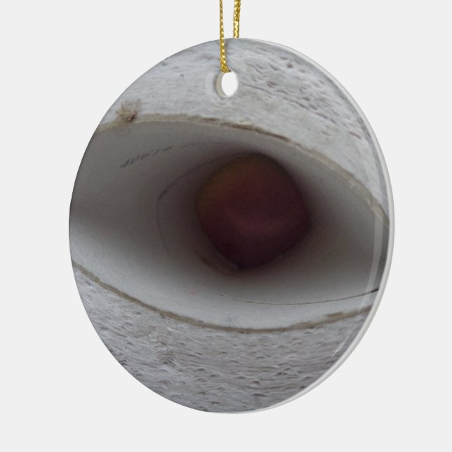 eye shaped hole, made of paper ceramic ornament (Left)