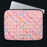 Eyeglasses Retro Modern Hipster Pink Gingham Name Laptop Sleeve<br><div class="desc">This colourful, nerdy eyeglass novelty design laptop sleeve has an original pattern made up of spectacles in a variety of shades and styles, all on a background of retro pink gingham. The cool, girly glasses' frames range from 50s and 60s cat eye / horn rimmed and browline shapes to round,...</div>