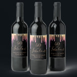 Fabulous birthday black pink gold drips wine label<br><div class="desc">A trendy and glamourous 50th (or any age) birthday label. A classic black background decorated with rainbow coloured faux glitter drips, paint dripping look in purple, pink and gold. With the text: 50 and fabulous. Personalize and add a name and a date. Date of birth or the date of the...</div>
