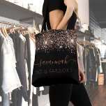 Fabulous birthday black rose gold glitter monogram tote bag<br><div class="desc">For a trendy and glamourous 50th (or any age) birthday. A chic black background decorated with rose gold glitter drops. With the text: 50 and fabulous. Personalize and add a name. Rose gold coloured text. The name is written with a modern hand lettered style script with swashes. To keep the...</div>