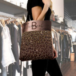 Fabulous birthday leopard pattern brown black tote bag<br><div class="desc">An elegant, glamourous and feminine 50th (or any age) birthday gift. With brown, golden and black leopard pattern, decorated with golden confetti. Personalize and add your name and monogram letter. With the text: 50 & Fabulous (x2) A faux bronze coloured band. Black and brown letters. The name is written with...</div>