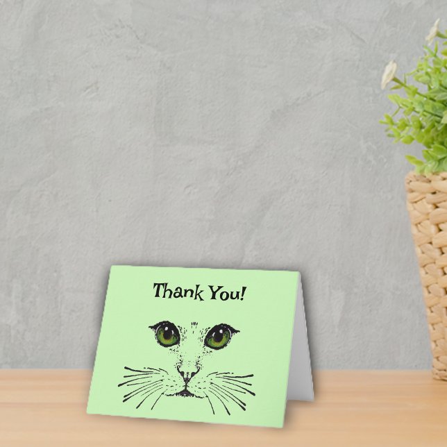 Face of Cat in black Green Eyes Whiskers Thank You (Kitty cat face in black with green eyes and whiskers on light green Thank You cards.)