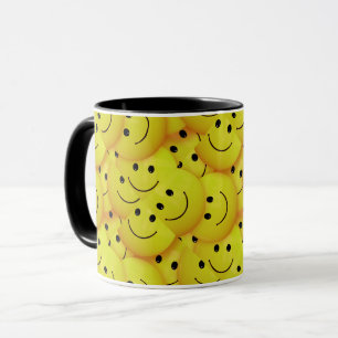 Faces everywhere, smiling faces, mug