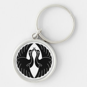 Facing white cranes keychain