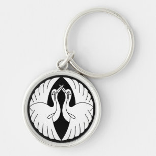 Facing white cranes keychain