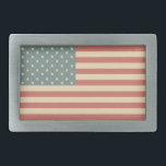 Faded American Flag Belt Buckle<br><div class="desc">Muted shades of red, blue and cream give this American Flag belt buckle a rustic, vintage feel. The design is from original art.</div>