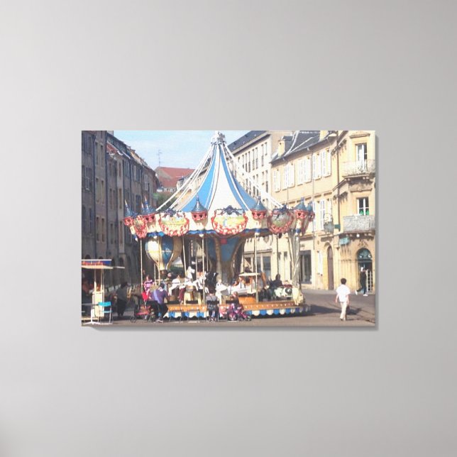 Fair Ground Roundabout in an Ancient French Town Canvas Print (Front)