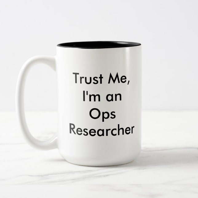Faites confiance à la tasse de chercheur d'Ops (Gauche)