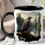 Falcon in Forest Wilderness Mug<br><div class="desc">Enjoy your favourite beverage with the Falcon in Forest Wilderness Mug. This captivating mug features a detailed image of a falcon perched on a rock, surrounded by a serene forest and mountains in the background. Customized with your name, it adds a personal touch that makes it uniquely yours. Perfect for...</div>