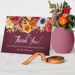 Fall Flowers 70th Birthday Folded Thank You Card<br><div class="desc">Elegant burgundy thank you card has a lush border of fall flowers across the top. Burnt orange, bright red, golden yellow and a pop of white. Thank you is written in a bright why trendy script. Two lines of text below let you customize your message. Of course there is room...</div>