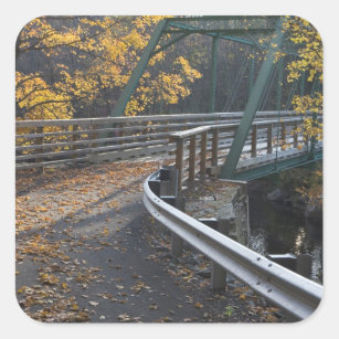 Fall foliage and a bridge over the Millers Square Sticker