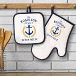 Family Beach House Anchor Gold Laurel Star White Oven Mitt & Pot Holder Set<br><div class="desc">A beautiful oven mitt & pot holder set featuring a custom designed boat anchor, gold style laurel leaves and a gold star with your personalized name and "Beach House" in nautical style typography. This design is in navy blue and gold colours on white or easily edit the design to change...</div>