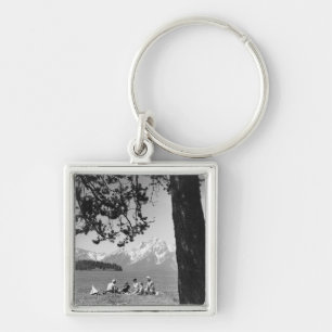 Family having picnic by lake mountains keychain