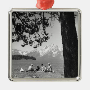 Family having picnic by lake mountains metal ornament