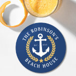Family Name Beach House Anchor Gold Laurel Navy Round Paper Coaster<br><div class="desc">A stylish nautical themed set of paper coasters with your personalized family name and beach house, lake house, or other desired text and established date. Features a custom designed boat anchor with gold style laurel leaves and a star on classic navy blue or easily customize the base colour to match...</div>