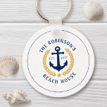 Family Name Beach House Anchor Gold Laurel Star Keychain<br><div class="desc">A stylish nautical style metal keychain with your personalized family name and beach house, lake house, or other desired text and established date. Features a custom designed boat anchor with gold style laurel leaves and a star on white or easily customize the base colour to match your current decor or...</div>