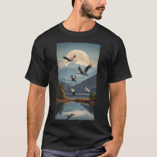Family of cranes flying over a lake with mountains T-Shirt