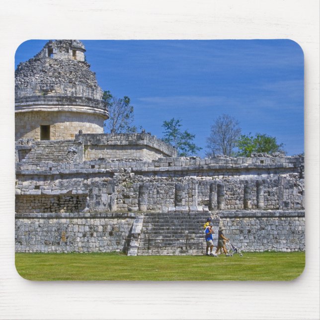 Family of tourists walk past ancient Mayan Mouse Pad (Front)