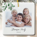 Family Photo Christmas  Ceramic Ornament<br><div class="desc">This Family Photo Christmas Ornament is decorated with watercolor mistletoe and stylish script typography. Easily customizable with your photo, name, and year. Use the Design Tool to change the text size, style, or colour. Because we create our artwork you won't find this exact image from other designers. Original Watercolor ©...</div>