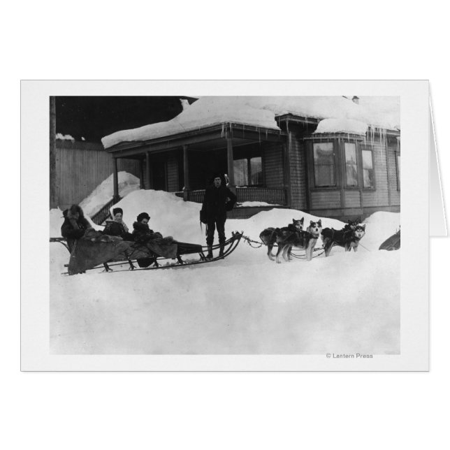 Family travelling by Dog Sled in Alaska (Front Horizontal)