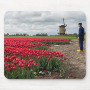 Farmer inspecting his tulips and windmill mouse pad