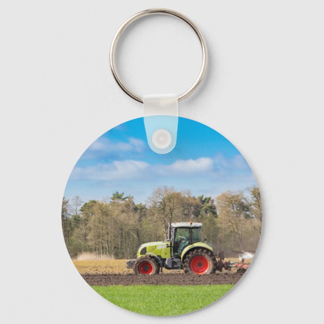 Farmer on tractor plowing sandy soil in spring keychain (Front)