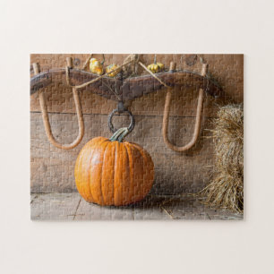 Farmers Museum. Pumpkin in barn with bale of hay Jigsaw Puzzle