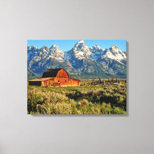 Farms   Barn Shadowed by Snow Capped Mountains Canvas Print