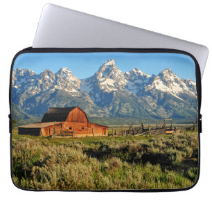 Farms   Barn Shadowed by Snow Capped Mountains Laptop Sleeve
