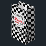 Fast ONE | Race Flag Chequered Birthday Gift Bag<br><div class="desc">Make the birthday boy’s gift as exciting on the outside as it is inside with this Fast ONE Custom Gift Bag! Featuring a bold black and white chequered flag background and a round label with classic crossed race car flags, this bag celebrates your little racer's big day with style. Personalized...</div>