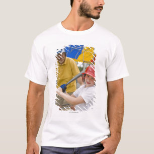 Father with daughter at batting cage T-Shirt