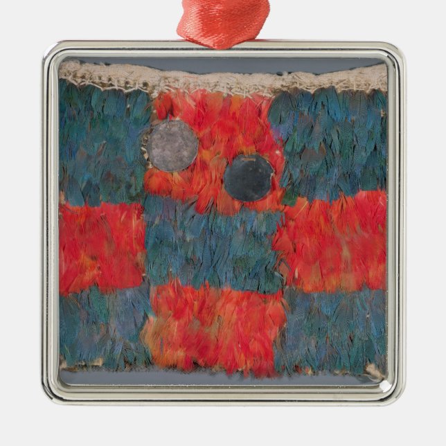 Feathered cape metal ornament (Front)