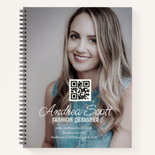 Female business boss add photo name q r code text notebook