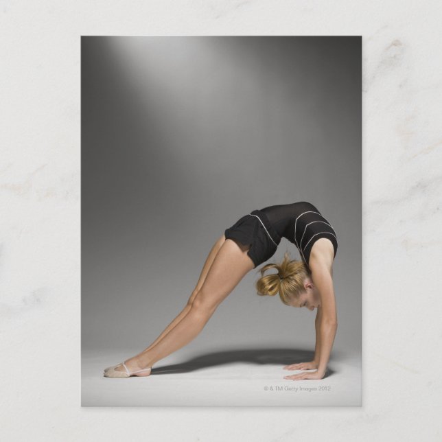 Female gymnast stretching, studio shot 2 postcard (Front)