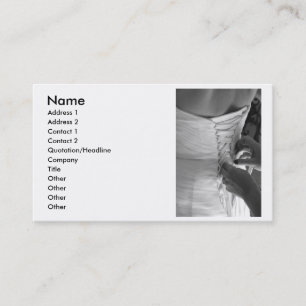 Female hand lacing up wedding dress back business card