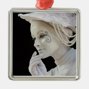 Female mime performing on street corner metal ornament