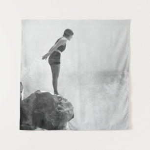 Female swimmer on rock above crashing surfvintage, tapestry