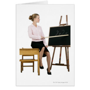 Female Teacher Pointing Ruler at Chalkboard