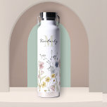 Feminine Boho Botanical Wildflowers with Monogram Water Bottle<br><div class="desc">Contemporary with a fresh feminine look, this lovely water bottle is bordered along the bottom in watercolor wildflowers with beautiful soft pastel colours of yellow, pink, blue and ivory beige. A text template is included to personalize with a first name and monogram initial of the last name. This high quality...</div>