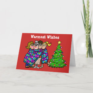 Femmes enveloppées dans la carte de Noël d'édredon
