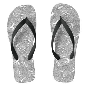 Fern in black and white flip flops