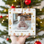 Festive babys first photo Christmas Tree Ornament<br><div class="desc">Celebrate your baby's first Christmas with this adorable personalized ornament. The pink and white background, adorned with Christmas gifts and trees, sets the scene for a cute and modern design. Add your child's photo to make it truly special and unique. The ornament is fully customizable, allowing you to create a...</div>