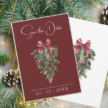 Festive Burgundy Green Winter Christmas Wedding Save The Date<br><div class="desc">Festive Burgundy Green Winter Christmas Wedding Save the Date Card - Elegant Foliage in Rustic Evergreen Hues. Embrace the enchantment of the season with our modern Christmas wedding save-the-date card, adorned in the rich and festive colours of red and green. This elegant save-the-date card features delicate foliage accents that evoke...</div>