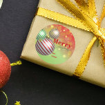 Festive Christmas Ornaments Twinkling Gold Lights Classic Round Sticker<br><div class="desc">This customizable Christmas sticker, set against a vibrant green backdrop, captures the essence of the festive season with its trio of beautifully designed Christmas ornaments in radiant hues of red, green, and gold, suspended from delicate golden strings. The sticker is further embellished with a heartwarming "Merry Christmas" message, penned in...</div>